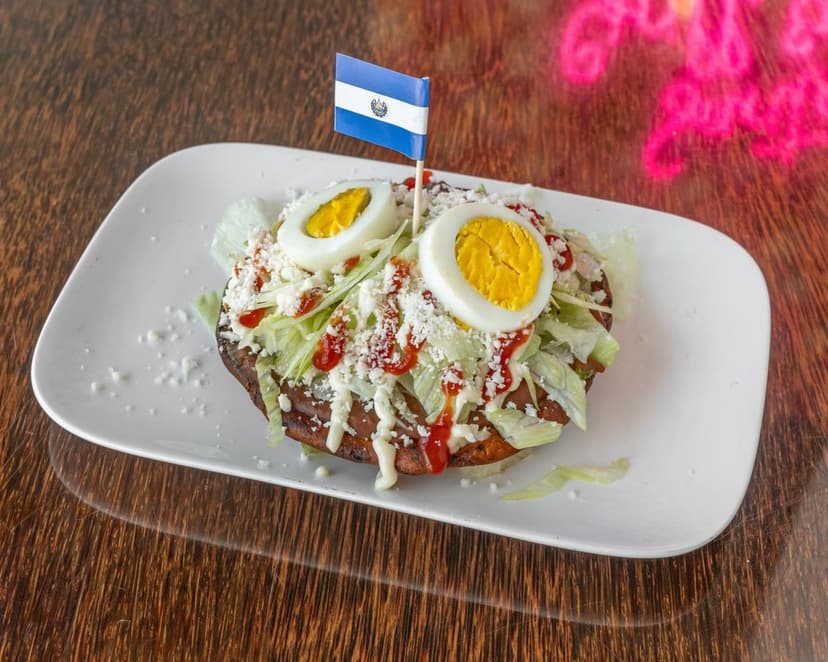 Salvadorian Enchiladas: Topped with egg and cheese.